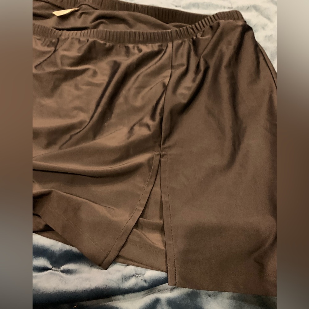 Catherine’s NWOT black swim skirt w/shorts and left side split size 5X